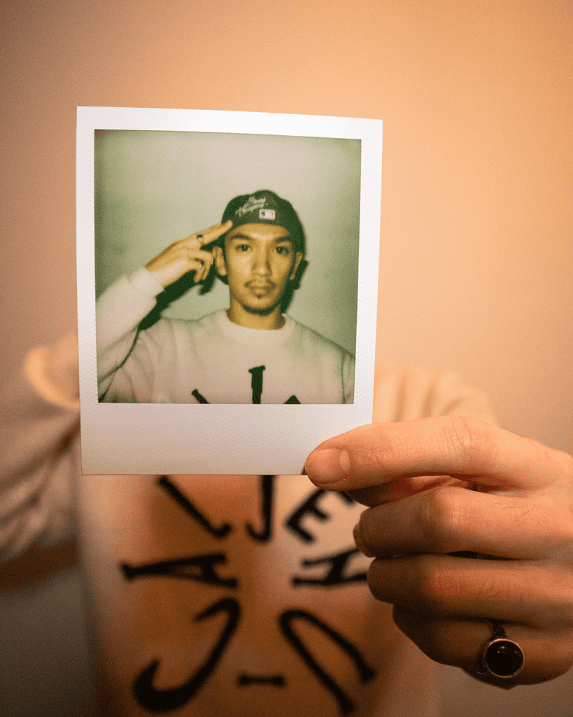 WaxBentayga poses with Polaroid picture for 9bills ones to watch for 2024
